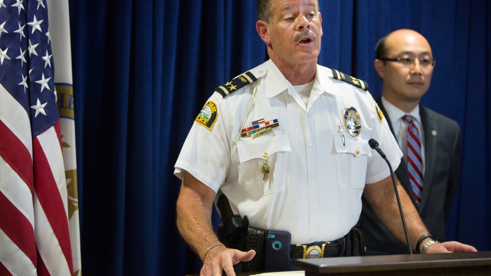 St. Paul Police Chief Tom Smith and Ramsey County Attorney John Choi announce criminal charges against the Archdiocese of Saint Paul and Minneapolis during a news conference on June 5, 2015 in St. Paul. (Jennifer Simonson/Minnesota Public Radio/AP)