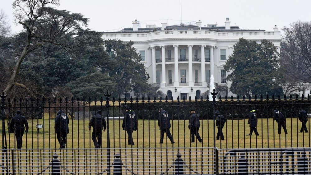 Secret Service officers search the south grounds of the White House in Washington, D.C., Jan. 26, 2015. (Photo by Susan Walsh/AP)