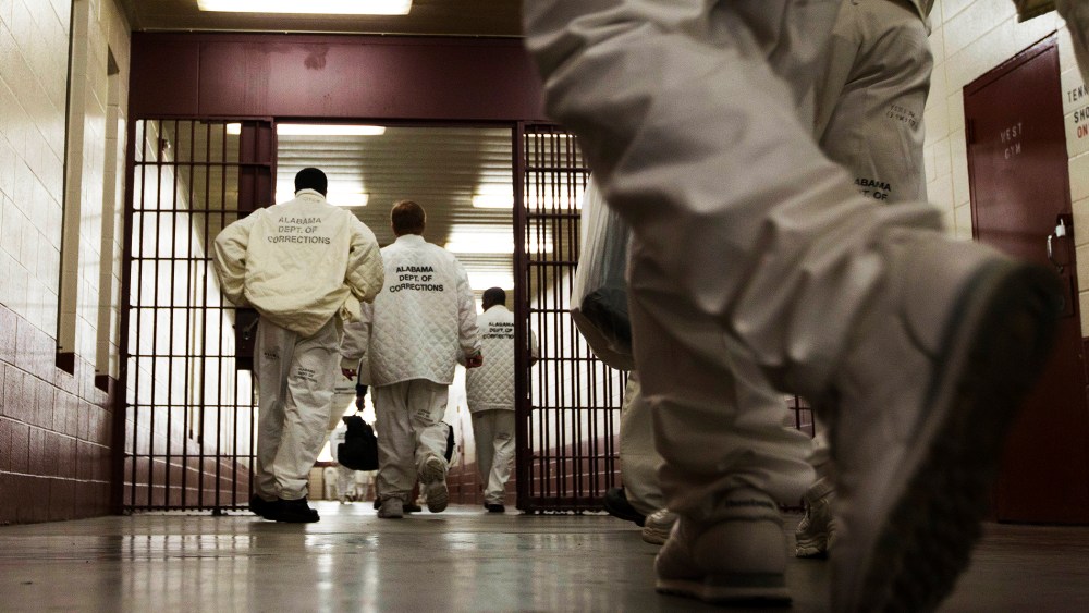 Inmates at William E. Donaldson prison in Bessemer, Ala., return to their cells.
