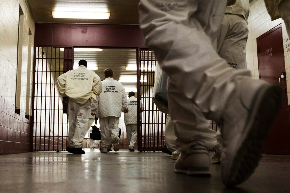 Inmates at William E. Donaldson prison in Bessemer, Ala., return to their cells.