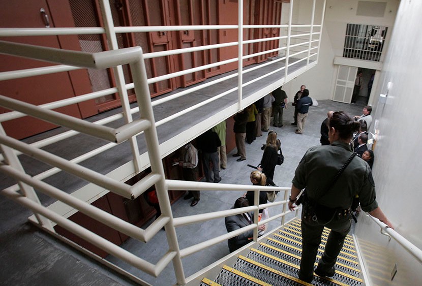 Reporters inspect one of the two-tiered cell pods in the Secure Housing Unit at the Pelican Bay State Prison near Crescent City, Calif., Wednesday, Aug. 17, 2011.  (Photo by Rich Pedroncelli/AP)