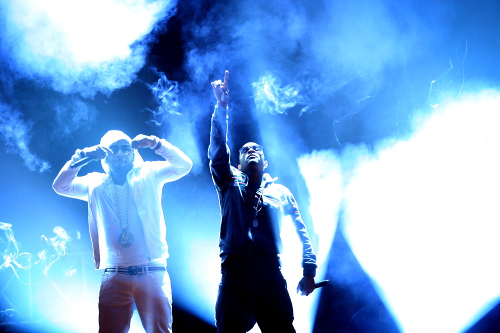 Rapper T.I., center, and Young Jeezy, left, perform during the BET Hip Hop Awards, Oct. 1, 2011 in Atlanta. (Photo by David Goldman/AP)