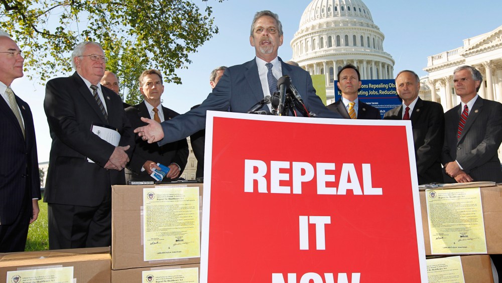 File Photo: Flanked by conservative lawmakers, Ken Hoagland, chairman of the Repeal It Now.org campaign, center, criticizes President Obama's national heath care plan, often called "Obamacare," Wednesday, Oct. 5, 2011, during a news conference on...