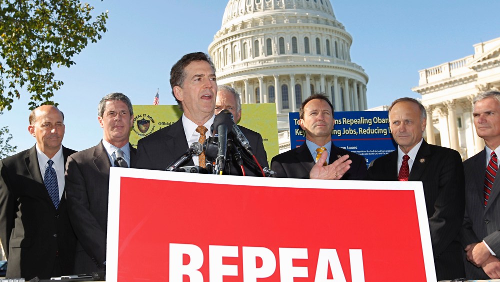 File Photo: Sen. Jim DeMint, R-SC, center, joins other conservatives lawmakers to criticize President Obama's national health care plan, often called "Obamacare," Wednesday, Oct. 5, 2011, during a news conference on Capitol Hill in Washington. The...