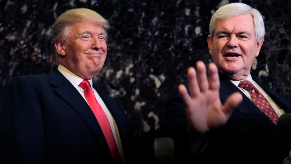 Donald Trump smiles at left as former House Speaker Newt Gingrich talks to media after their meeting in New York, Dec. 5, 2011. (Photo by Seth Wenig/AP)
