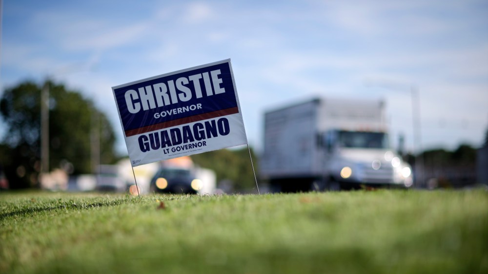 A campaign sign for New Jersey Gov. Chris Christie and Lt. Gov.  Kim Guadagno is seen along a highway in Edison, N.J., Tuesday, Oct. 8, 2013.