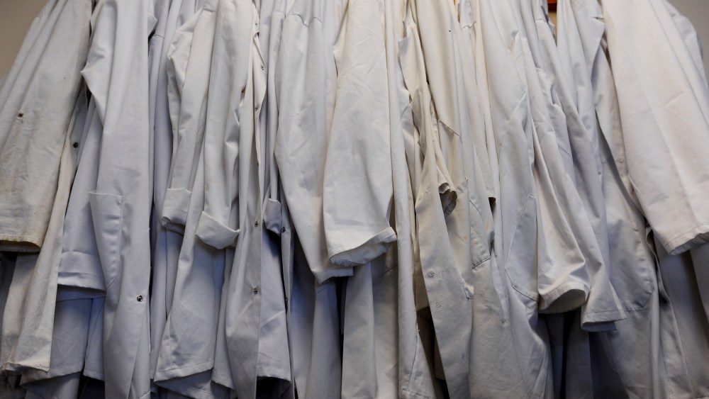 Laboratory coats hang up in a classroom, Jan. 27, 2015. (Photo by Lauren Hurley/PA Wire/AP)