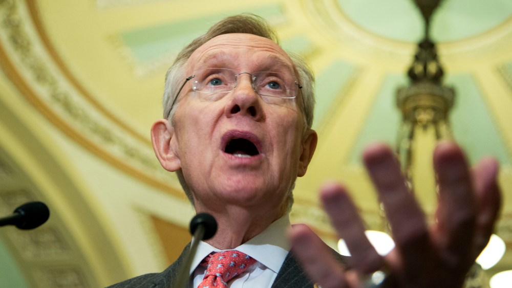 Senate Majority Leader Sen. Harry Reid of Nev gestures as he speaks to reporters on Capitol Hill in Washington.  (Photo by Manuel Balce Ceneta/AP Photo)