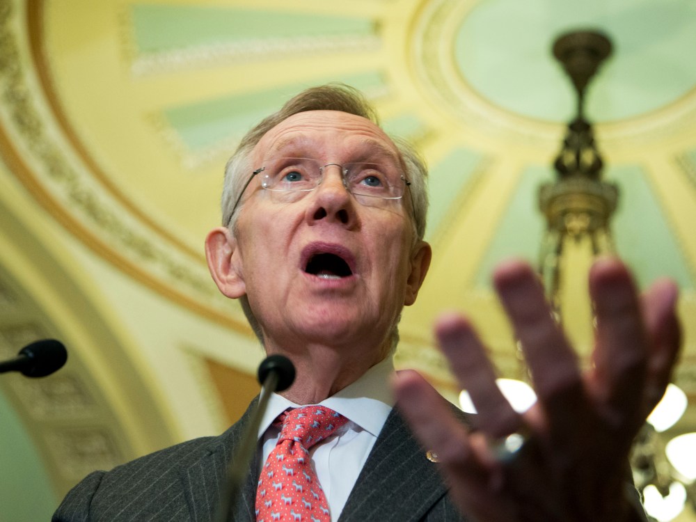 Senate Majority Leader Sen. Harry Reid of Nev gestures as he speaks to reporters on Capitol Hill in Washington.  (Photo by Manuel Balce Ceneta/AP Photo)