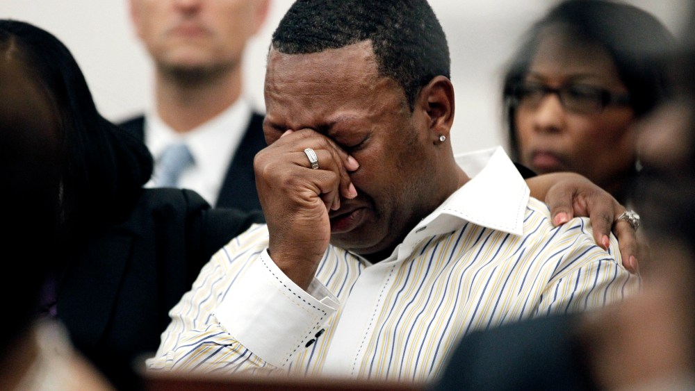 A family member cries as Barbara Anderson Young, sister of James Craig Anderson, reads a statement in Hinds County Circuit Court, March 21, 2012 in Jackson, Miss. (Photo by Rogelio V. Solis/AP)