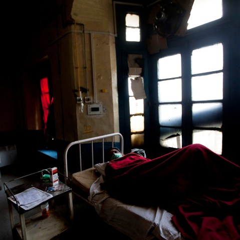 A tuberculosis patient Abdul Rasheed lies on a bed in an isolated ward at the Chest Disease Hospital on World Tuberculosis Day in Srinagar, India, March 24, 2012.