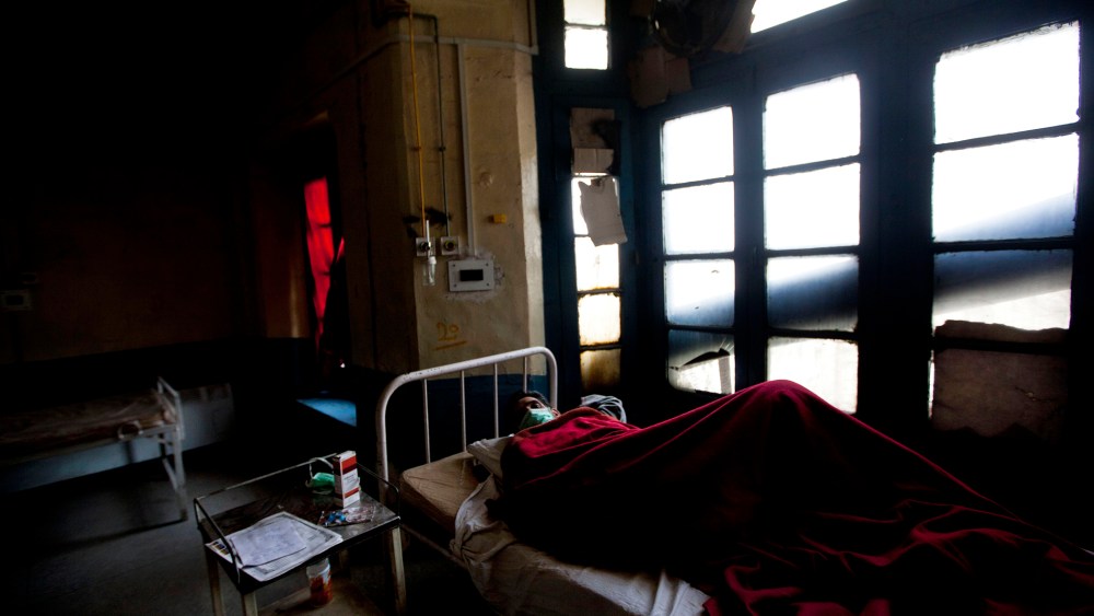 A tuberculosis patient Abdul Rasheed lies on a bed in an isolated ward at the Chest Disease Hospital on World Tuberculosis Day in Srinagar, India, March 24, 2012.