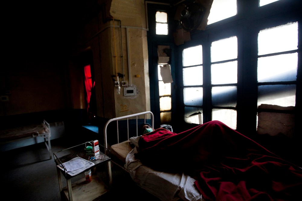 A tuberculosis patient Abdul Rasheed lies on a bed in an isolated ward at the Chest Disease Hospital on World Tuberculosis Day in Srinagar, India, March 24, 2012.
