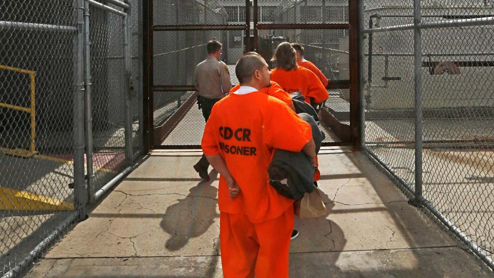 New arrivals to the Deuel Vocational Institution are taken inside the prison near Tracy, Calif., Feb. 20, 2014.