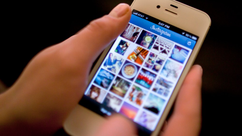 Instagram is demonstrated on an iPhone Monday, April 9, 2012, in New York. Facebook is spending $1 billion to buy the photo-sharing company Instagram in the social network's largest acquisition ever. Instagram lets people apply filters to photos they...