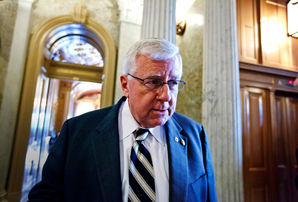 Sen. Mike Enzi pauses for questions on Capitol Hill in Washington, May 8, 2012.