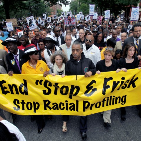 The Rev. Al Sharpton, center, walks with demonstrators during a silent march to end the "stop-and-frisk" program in New York, Sunday, June 17, 2012. Thousands of protesters from civil rights groups walked down New York Citys Fifth Avenue in total...