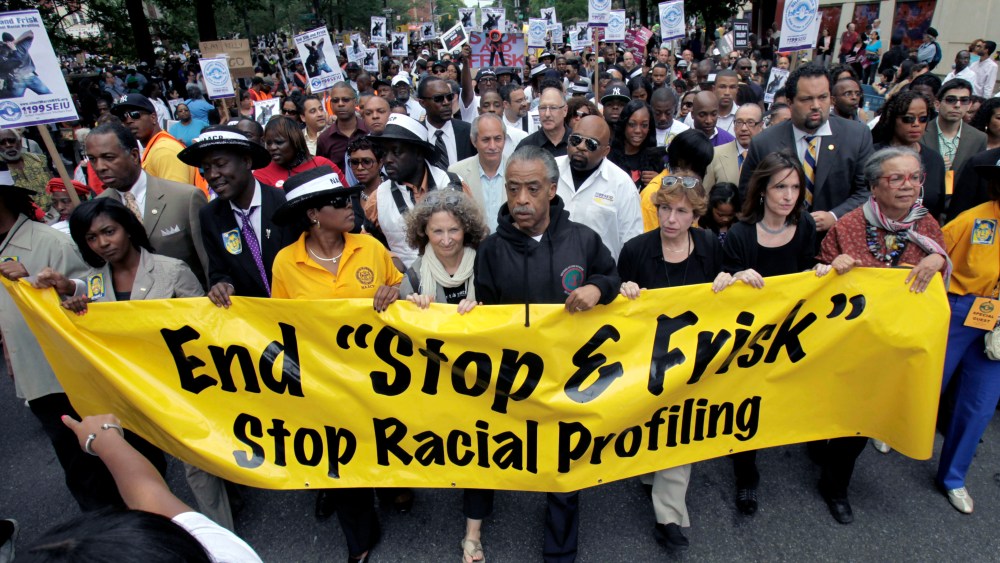 The Rev. Al Sharpton, center, walks with demonstrators during a silent march to end the "stop-and-frisk" program in New York, Sunday, June 17, 2012. Thousands of protesters from civil rights groups walked down New York Citys Fifth Avenue in total...