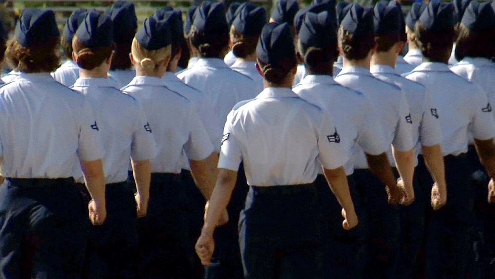 In this June 22, 2012, image made from video, female airmen march during graduation at Lackland Air Force Base in San Antonio, Texas. (Photo by John L. Mone/AP)