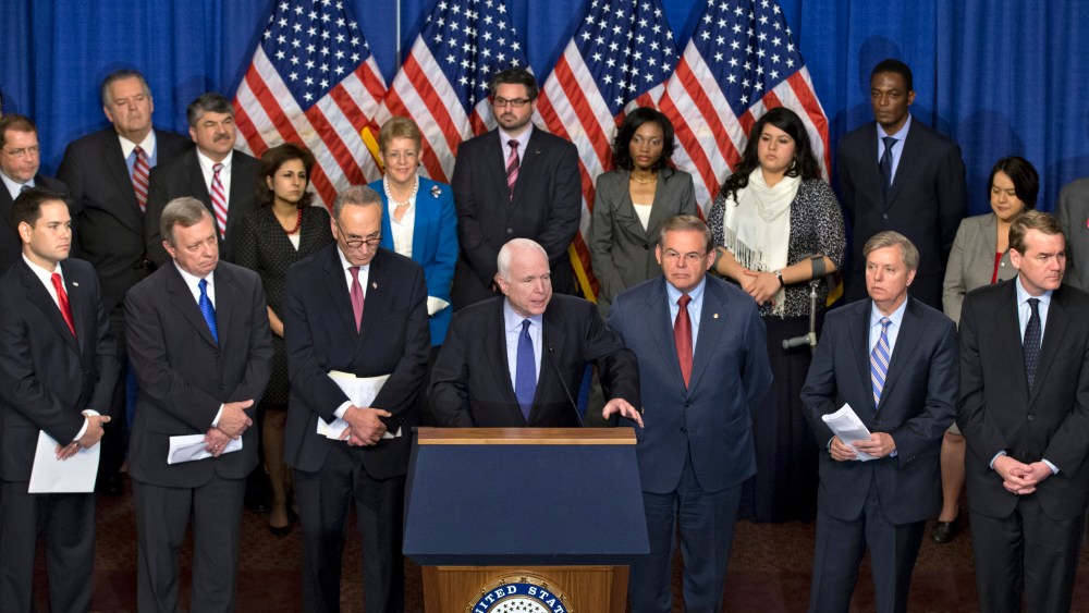 Sen. John McCain, R-Ariz., center, speaks as immigration reform legislation as outlined by the Senate's bipartisan "Gang of Eight" that would create a path for the nation's 11 million unauthorized immigrants to apply for U.S. citizenship, Thursday,...