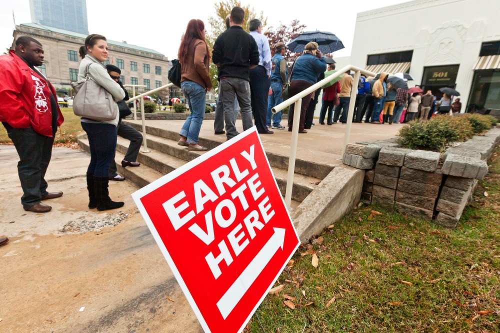 Arkansas voters line up in the rain at an early voting poling place in Little Rock, Ark., Nov. 5, 2012.