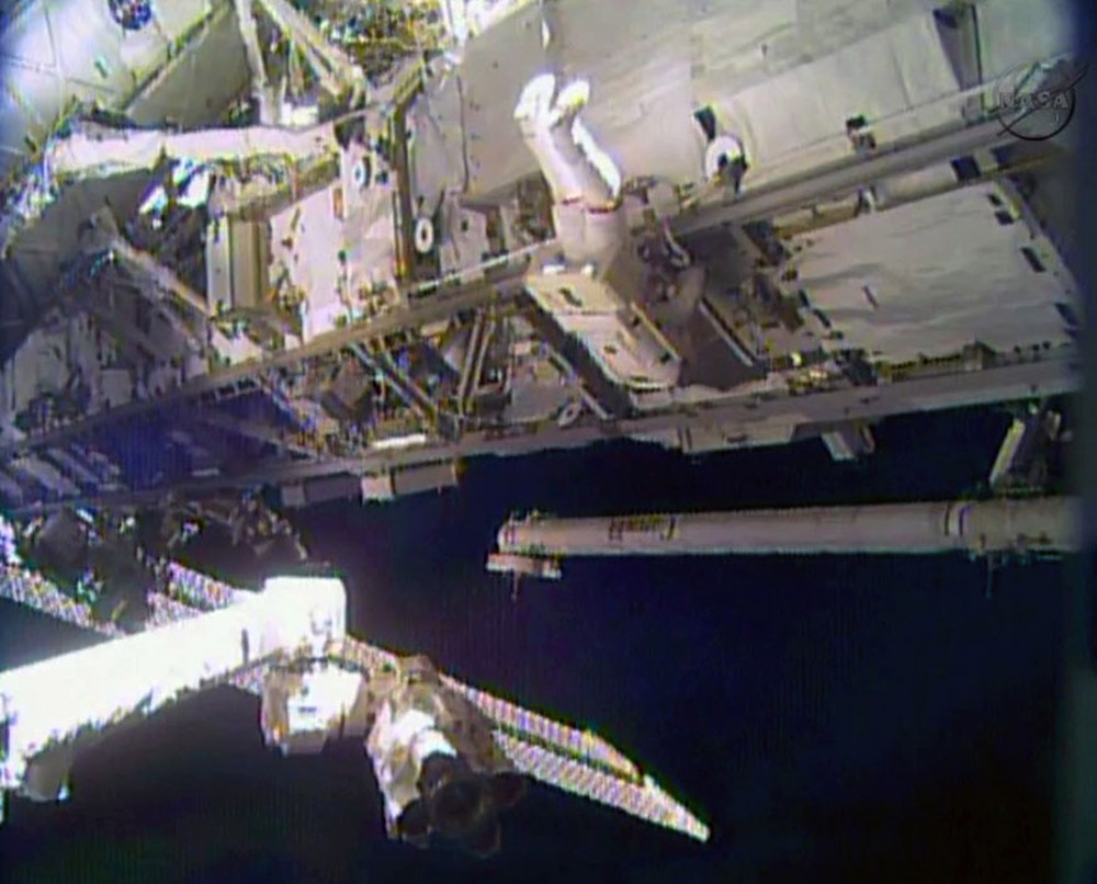 In this image made from video provided by NASA, astronaut Rick Mastracchio performs a space walk outside the International Space Station on Saturday, Dec. 21, 2013.
