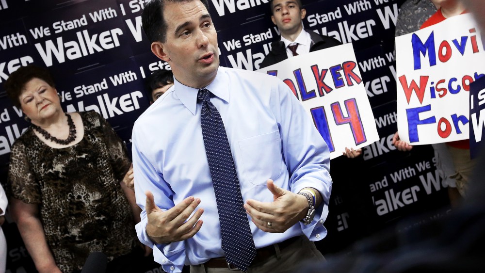 Wisconsin Gov. Scott Walker addresses members of the media during a stop at the Madison GOP field office in Madison, Wis., Wednesday, July 23, 2014.