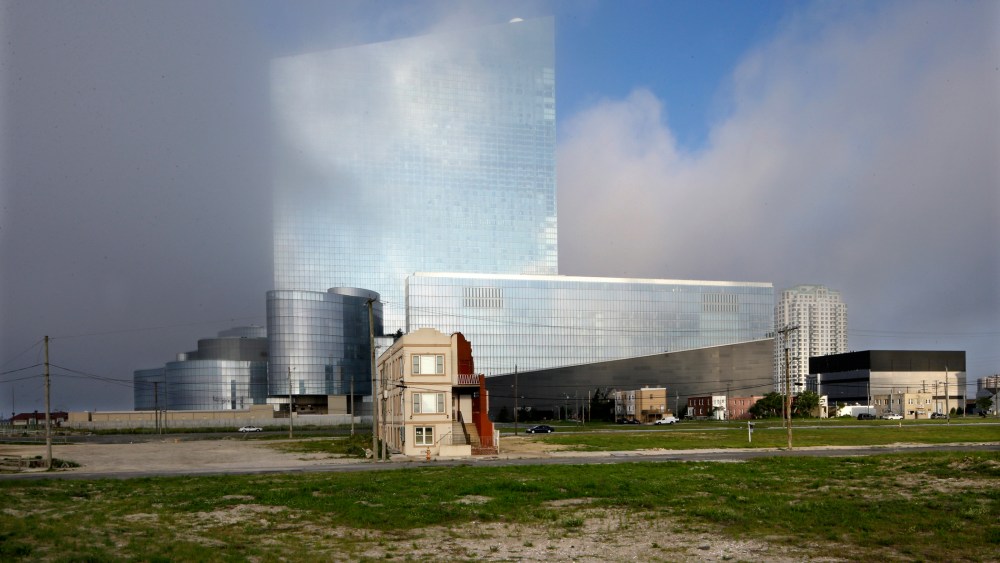 The last old home on a block, center left, is seen near the Revel hotel and casino in Atlantic City, N.J.