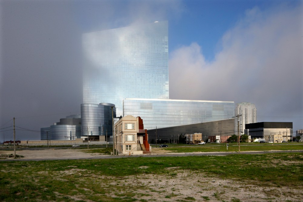 The last old home on a block, center left, is seen near the Revel hotel and casino in Atlantic City, N.J.