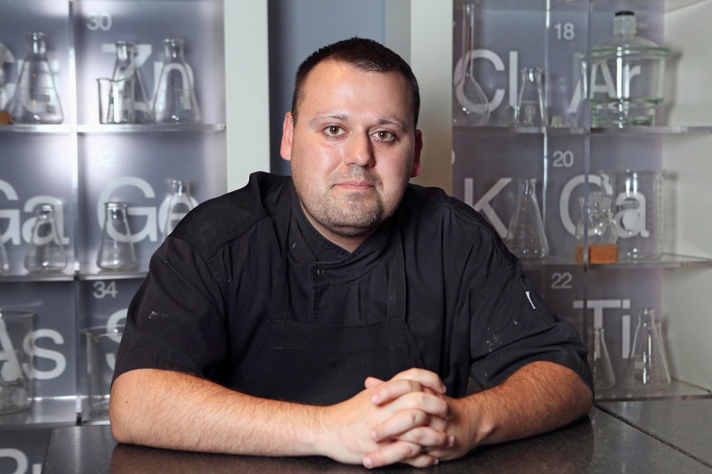 In this Nov. 7, 2013 photo Chef Homaro Cantu poses for a photo at his restaurant Moto in Chicago. (Photo by Chandler West/Sun-Times Media/AP)