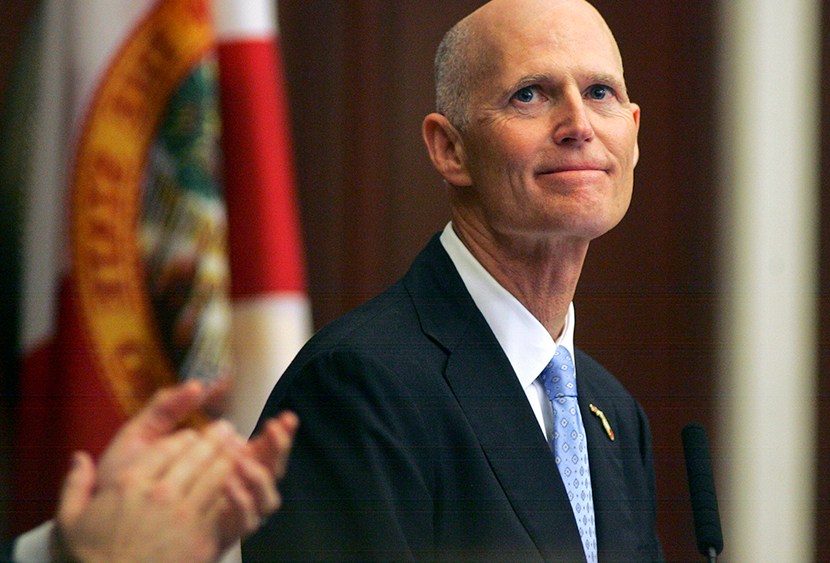 Gov. Rick Scott smiles as he receives applause during his State of the State address Tuesday, March 5, 2013, in the Florida House of Representatives in Tallahassee, Fla. (Photo by Phil Sears/AP)