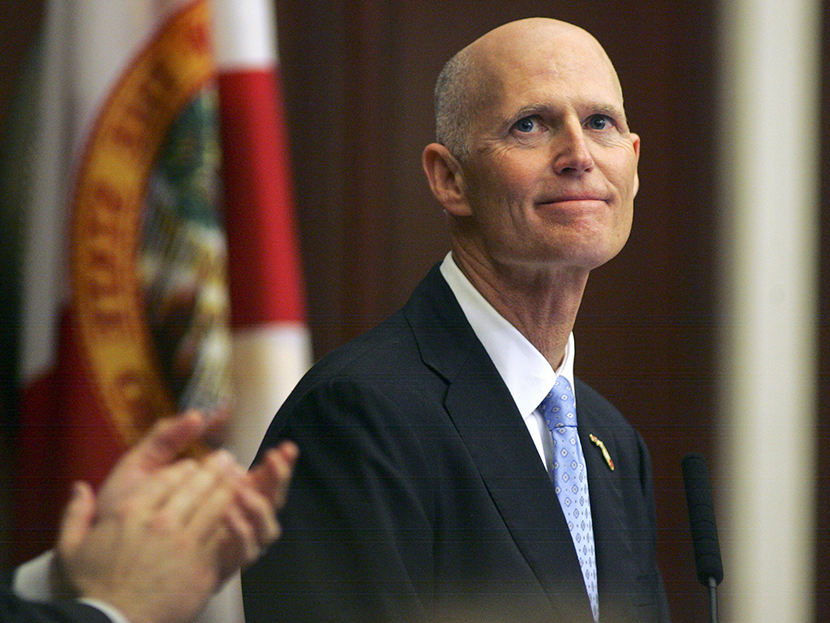 Gov. Rick Scott smiles as he receives applause during his State of the State address Tuesday, March 5, 2013, in the Florida House of Representatives in Tallahassee, Fla. (Photo by Phil Sears/AP)