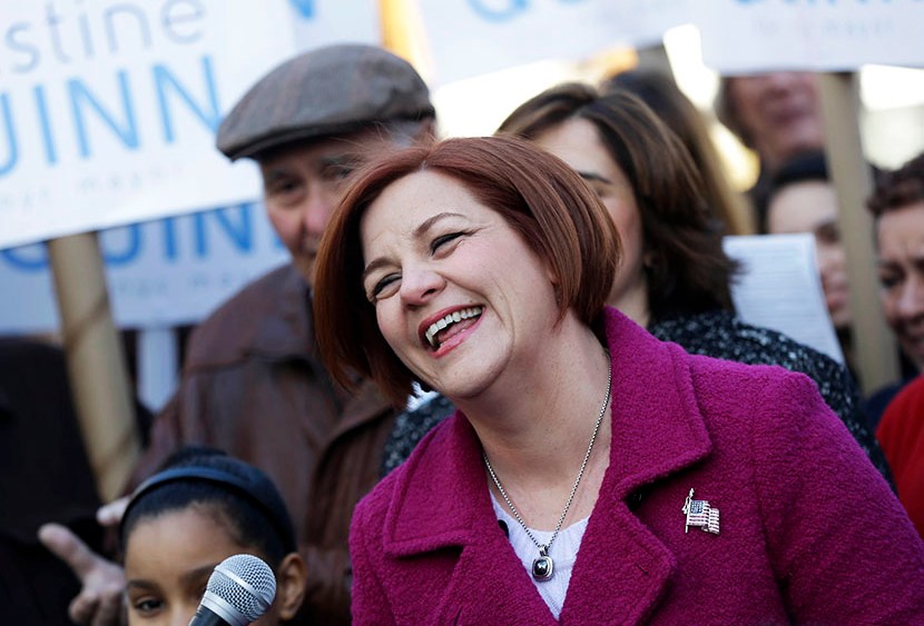 Surrounded by family and supporters, New York City Council speaker and mayoral hopeful Christine Quinn, center, laughs while speaking to the media as she announces her mayoral run in New York, Sunday, March 10, 2013. (Photo by Seth Wenig/AP)