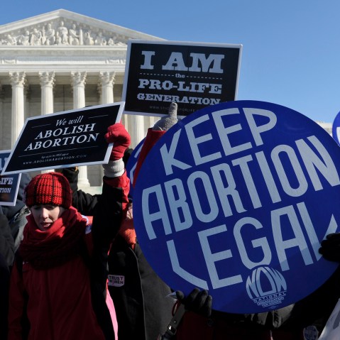 Pro-abortion and anti-abortion protestors rally outside the Supreme Court in Washington, D.C., Jan. 22, 2014.
