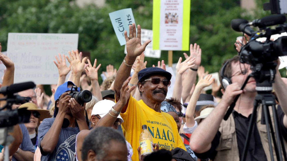 Demonstrators and NAACP-led supporters opposing the Republican legislature's agenda congregate at Halifax Mall during "Moral Monday" protests at the General Assembly in Raleigh, N.C., Monday, June 24, 2013.