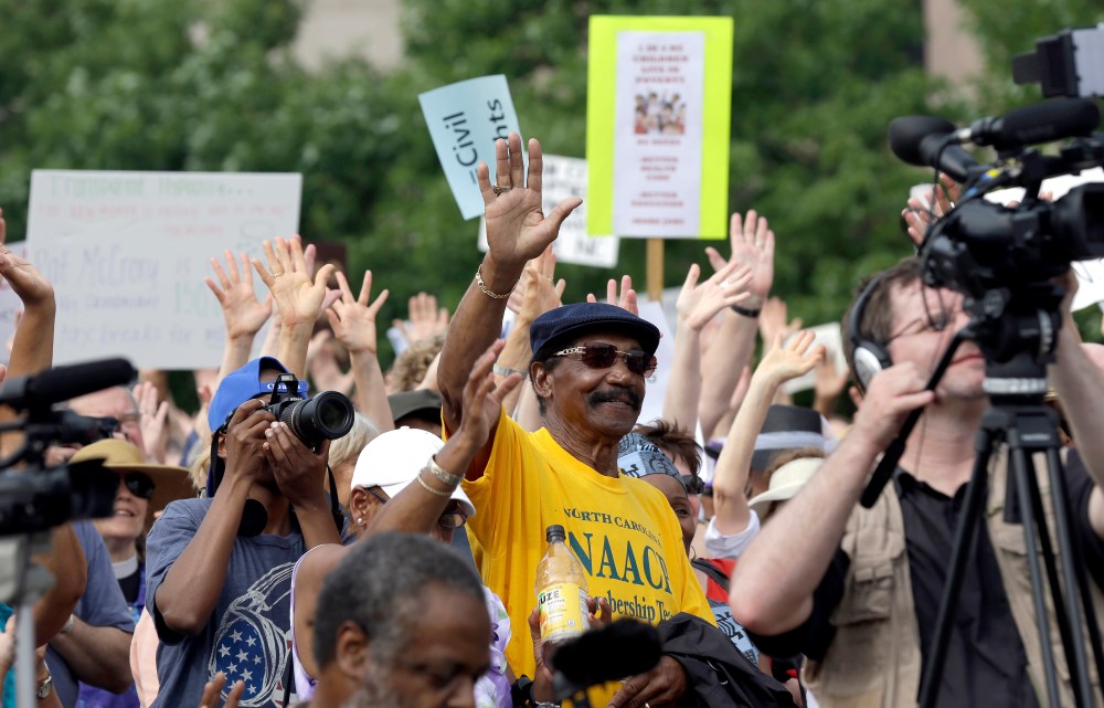Demonstrators and NAACP-led supporters opposing the Republican legislature's agenda congregate at Halifax Mall during "Moral Monday" protests at the General Assembly in Raleigh, N.C., Monday, June 24, 2013.