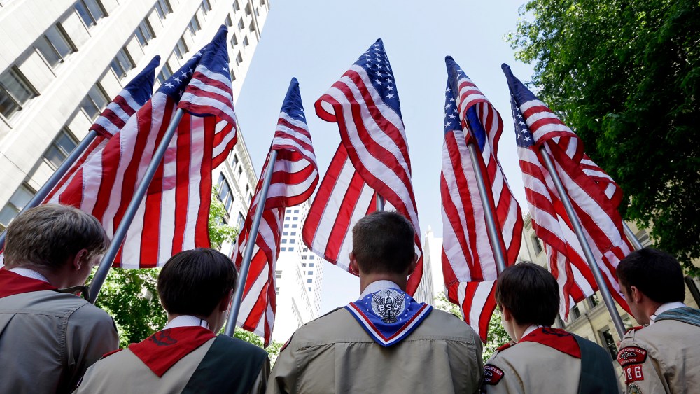 Boy Scouts from the Chief Seattle Council carry U.S. flags as they prepare to march in the Gay Pride Parade, June 30, 2013, in downtown Seattle. (Photo by Elaine Thompson/AP)