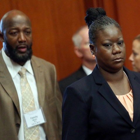 Trayvon Martin's parents Tracy Martin, left, and Sybrina Fulton, enter the courtroom after a recess in George Zimmerman trial in Seminole circuit court, in Sanford, Fla., Wednesday, July 3, 2013.