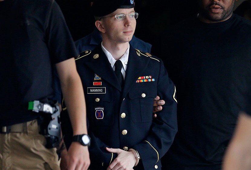 Army Pfc. Bradley Manning is escorted out of a courthouse in Fort Meade, Md., Tuesday, July 30, 2013, after receiving a verdict in his court martial. (Photo by Patrick Semansky/AP)