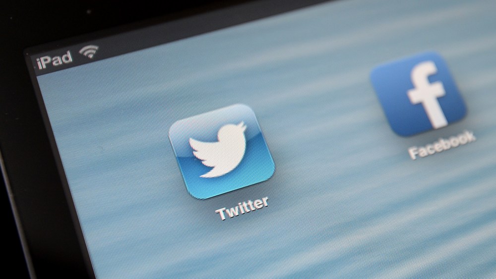 General Stock - Twitter. General view of the Twitter app icon next to the Facebook app icon being viewed on an iPad. Picture date: Tuesday July 30, 2013. Photo credit should read: Andrew Matthews/PA Wire URN:17192998