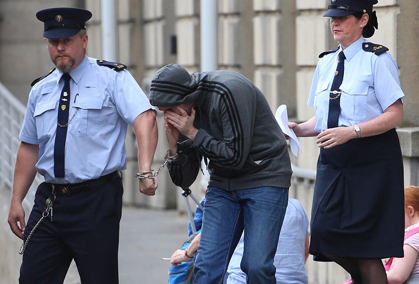 Eric Eoin Marques is led away from the High Court in Dublin after authorities in the United States have formally requested his extradition. Picture date: Thursday August 15, 2013. (Photo by Niall Carson/PA Wire/AP)