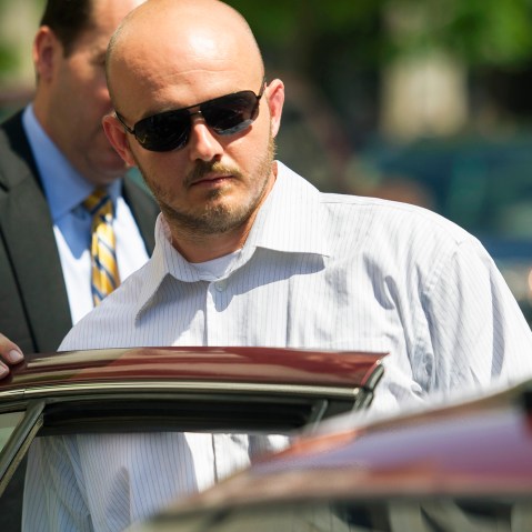 In this June 11, 2014, file photo, former Blackwater Worldwide guard Nicholas Slatten enters a taxi cab as he leaves federal court in Washington, D.C., after the start of his trial. (Photo by Cliff Owen/AP)