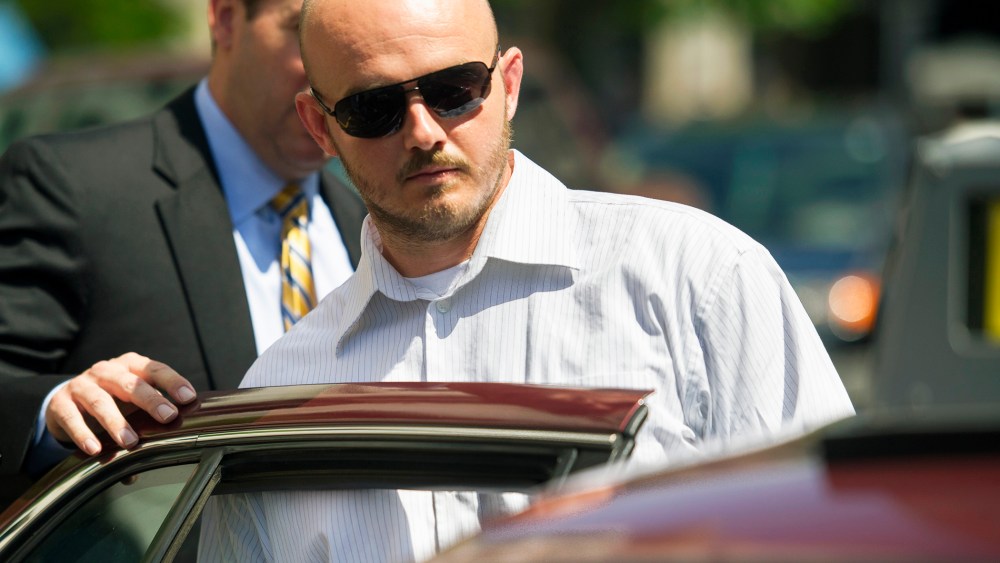 In this June 11, 2014, file photo, former Blackwater Worldwide guard Nicholas Slatten enters a taxi cab as he leaves federal court in Washington, D.C., after the start of his trial. (Photo by Cliff Owen/AP)