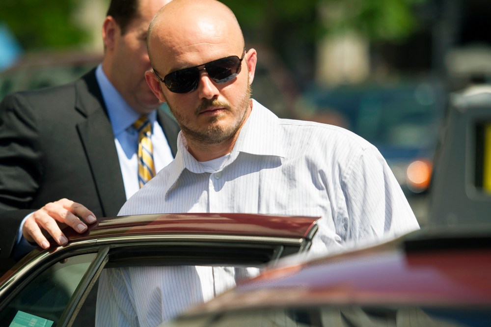 In this June 11, 2014, file photo, former Blackwater Worldwide guard Nicholas Slatten enters a taxi cab as he leaves federal court in Washington, D.C., after the start of his trial. (Photo by Cliff Owen/AP)