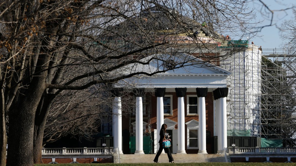 A student walks across the Lawn in front of the Rotunda at the University of Virginia Wednesday on Feb. 20, 2013 in Charlottesville, Va. (Steve Helber/AP)
