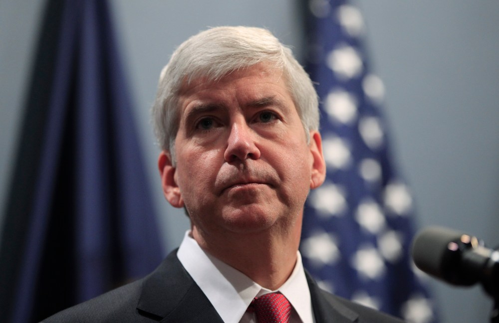Gov. Rick Snyder says he's giving "extra consideration" to a bill that would make it easier to carry guns in Michigan schools (Photo by Carlos Osorio/AP)