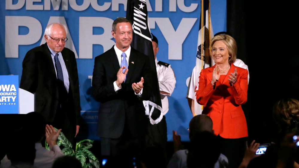 Democratic presidential candidates, Bernie Sanders, Martin O'Malley and Hillary Rodham Clinton during the Iowa Democratic Party's Hall of Fame Dinner, July 17, 2015, in Cedar Rapids. (Photo by Charlie Neibergall/AP)