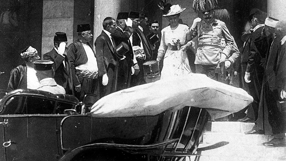 Archduke of Austria Franz Ferdinand walks to a car with his wife Sophie in Sarajevo on June 28, 1914, minutes before his assassination.