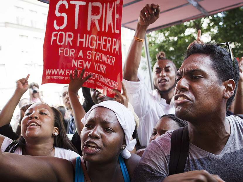 Demonstrators supporting fast food workers protest outside a McDonald's as they demand higher wages and the right to form a union without retaliation  Monday, July 29, 2013, in New York's Union Square.  (Photo by John Minchillo/AP)