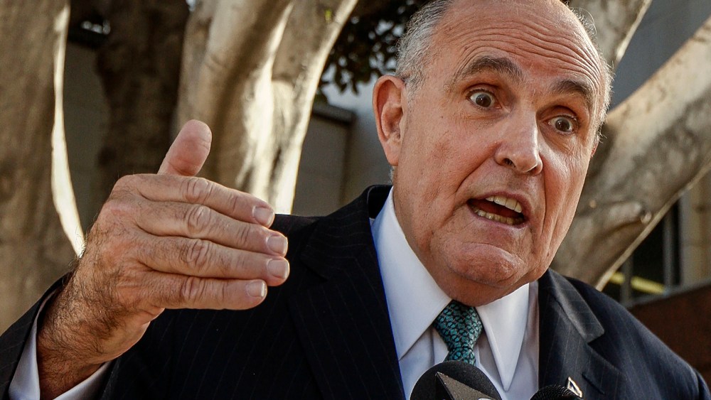 Lawyer and former New York City Mayor Rudy Giuliani comments on a lawsuit filed against video game giant Activision outside Los Angeles Superior court in Los Angeles, Calif., on Oct. 16, 2014. (Photo by Damian Dovarganes/AP)